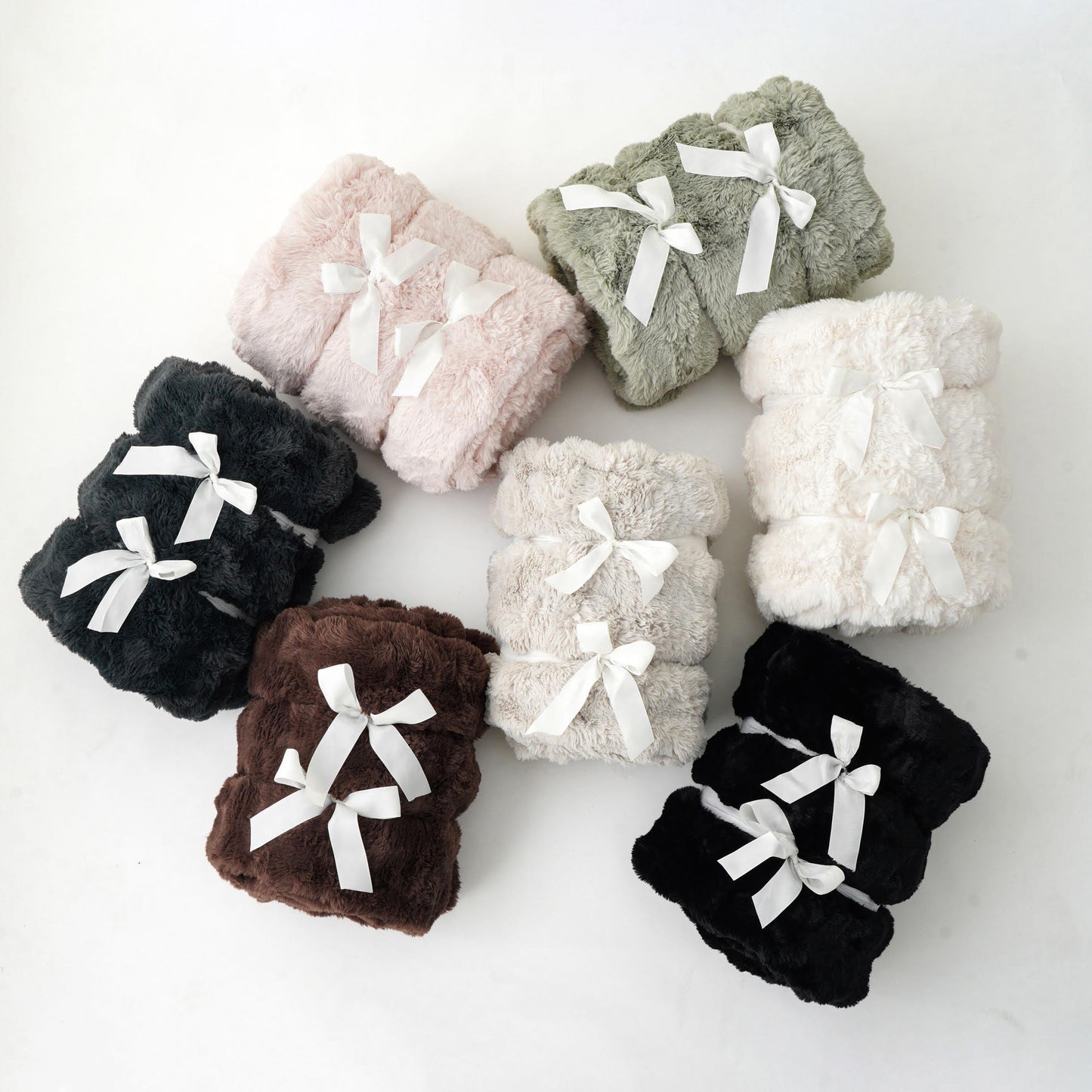 Brook Snuggle minky blanket in Espresso Black Slate Desert Sage Off White and Moonstone colorways grouped together ultra soft bubbled texture Wrapped in Love Pocket Love Movement